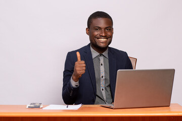 Wall Mural - confident black businessman does a thumbs up gesture