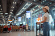 © Kiattisak - Traveler with suitcase in airport concept.Young girl walking with carrying luggage and passenger for tour travel booking ticket flight at international vacation time in holiday rest and relaxation..