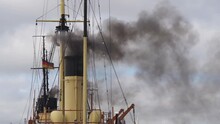 Yellow Chimney Of A Coal Steamer Steams Black Smoke