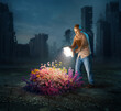 © Kevin Carden - Man reveals flowers with glowing book