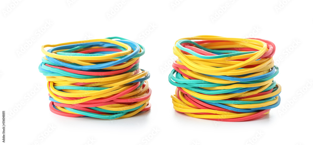 Stacks of colorful rubber bands isolated on white background