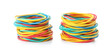 Stacks of colorful rubber bands isolated on white background