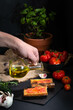 Pouring olive oil on the top of traditional Spanish appetiser - 