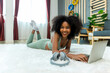 © kanpisut - Woman doing yoga at home in the living room. Woman is stretching in yoga at home. work out time