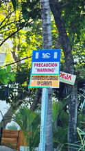 Sign Warning Of Rip Tides On The Beach In Tamarindo, Costa Rica
