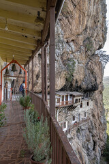 Prodromos Monastery, the largest and most historic in Peloponnese, hangs from the rocks above Lousios Gorge, located near Stemnitsa village, Arcadia, Greece.