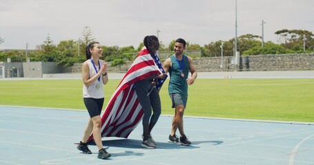 Canvas Print - Team of patriotic olympic athletes celebrating victory, walking and cheering on a track outside. Three diverse american runners carrying the US national flag after winning silver and gold medals