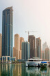 © ArturSniezhyn - Sea yachts against the backdrop of the skyscrapers of Dubai, daytime cityscape