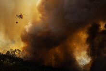 I-RUFA Eurocopter AS 350B3 Firefighter, Dropping Water In A Forest Fire During Day In Povoa De Lanhoso, Portugal.
