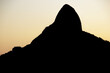 Two Hill Brother silhouette with a beautiful sunset sky in Rio de Janeiro, Brazil.