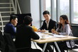 © FotoArtist - Young Asian business team people meeting in office