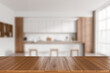 © ImageFlow - Wooden island on blurred background of light kitchen interior. Mockup