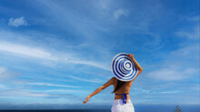 Summer holiday with  young woman in hat at  happy freedom lifestyle in Aegean sea mediterranean at Santorini,greece