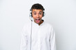 © luismolinero - Telemarketer Brazilian man working with a headset isolated on white background with surprise facial expression
