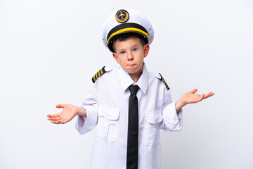 Wall Mural - Little airplane pilot boy isolated on white background having doubts while raising hands