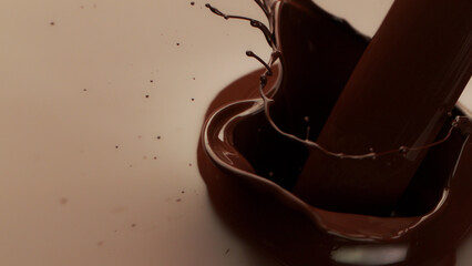 Poster - Melted chocolate pouring in detail, floating on surface.