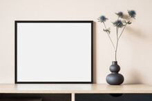 Empty Horizontal Frame Mockup In Modern Minimalist Interior With Plant In Trendy Vase On Beige Wall Background. Template For Artwork, Painting, Photo Or Poster