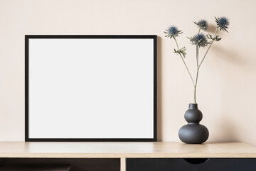 Wall Mural - Empty horizontal frame mockup in modern minimalist interior with plant in trendy vase on beige wall background. Template for artwork, painting, photo or poster