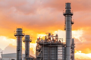 Industrial view at oil refinery plant form industry zone with sunset sky background