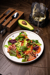 Poster - Fresh salad with chicken, tomatoes, spinach and avocado on white background top view. Healthy food. Space for text.