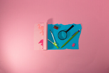 creative design paper is torn and the flamingo and summer spells are left behind, a new sheet opens with school supplies, back to school, study time, pink background