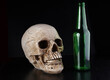 Skull and bottle on black
