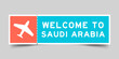 Orange and blue color ticket with plane icon and word welcome to saudi arabia on gray background