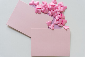 pink hearts and blank paper cards for your message