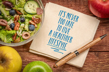 It's Never Too Late To Live A Healthier Lifestyle, Inspirational Note On A Napkin With Green Salad And Apples