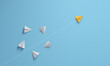 © ImagesRouges - Individual and innovator leader paper airplane changing direction. Leadership concept.