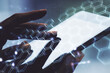 © Pixels Hunter - Double exposure of technology hologram with hexagon and finger clicks on a digital tablet on background. Research and development software concept