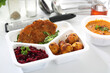 Dietary catering. Veal schnitzel with baked potatoes and beetroot salad. Box diet. Appetizing lunch boxes. Food delivered to your home