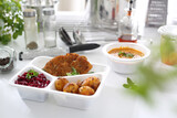 Fototapeta  - Catering. Veal schnitzel with baked potatoes and beetroot salad. Appetizing lunch boxes. Food delivered to your home