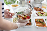 Fototapeta  - Salad with grilled chicken. Box diet. Appetizing lunch boxes. Food delivered to your home