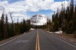 Scenic Road, Snowy Mountain and Trees. Spring Season. Hayden Pass, Utah. United States. Nature Background.