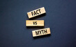 © Dzmitry - Fact vs myth symbol. Concept words Fact vs myth on wooden blocks on a beautiful black table black background. Business, finacial and fact vs myth concept. Copy space.