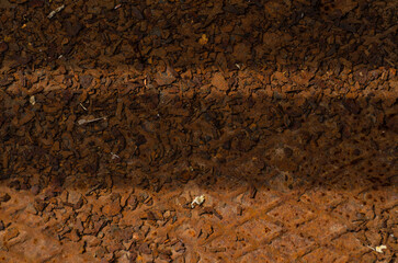 Industrial old rust metal steel surface with rhombus shapes or checkered plates. Rusty metal background with two horizontal shadows