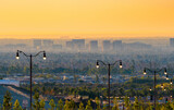 Fototapeta Góry - Streetlights in Suburban Orange County landscape at sunset in Southern California	