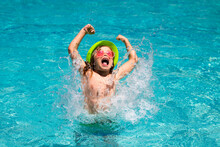 Kid Splashing In Swimming Pool. Little Child Boy In Swimming Pool Swim On Summer Vacation. Beach Sea And Water Fun.