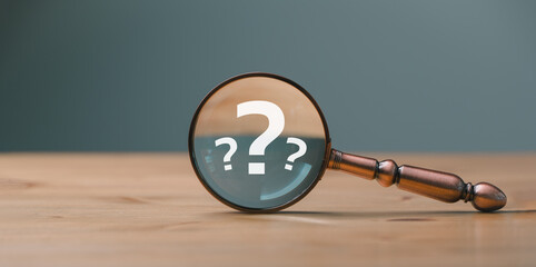 close up magnifier glass with question mark, concept of finding or searching for idea, search for in