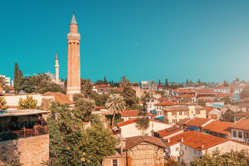 Wall Mural - Yivli or flute minaret mosque is a religious symbol and travel landmark of Antalya resort town in Turkey. Attractions and destinations in Kaleice old town