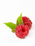 Fototapeta  - Ripe raspberries with leaves isolated on white background