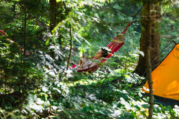 Poster - woman laying down in hammock reading book