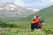 © Antonioguillem - Hiker sitting contemplating views in the mountain