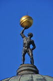 Fototapeta Londyn - Sculpture of Atlas on the dome of Skorzewski Palace. Lubostron, Kuyavian-Pomeranian Voivodeship, Poland