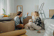 © Halfpoint - Cheerful young couple in their new apartment. Conception of moving.