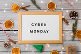 Fototapeta Do przedpokoju - online shopping, season sale and internet marketing concept - white magnetic board with cyber monday words and christmas decorations over grey shabby wooden background
