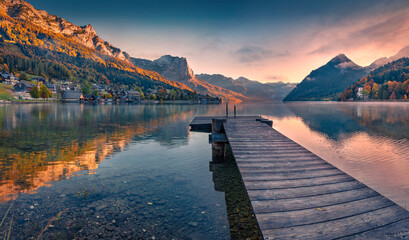 Sticker - Fishing pier in the calm pond. Picturesque autumn view of Grundlsee lake. Wonderful morning scene of Eastern Alps, Liezen District of Styria, Austria, Europe. Traveling concept background.