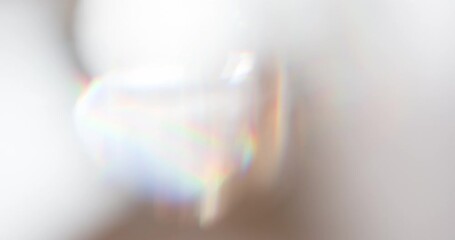 Wall Mural - Slow Play Rainbow Crystal. Loop. The light passes through the facets of a slowly rotating diamond and creates repetitive sparkling highlights and rainbow colors