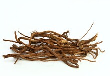 Organic Dried Roots Of Dandelion, Taraxacum Officinale, Traditional Herbal Medicine. Roots Prepared For Making Tinctures And Medicine On The White Background.